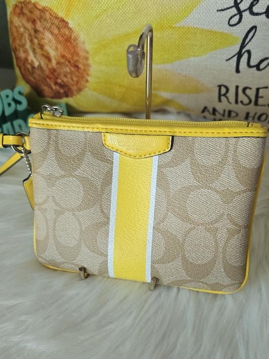 Coach Handbags - Coach Beige Signature Canvas Wristlet with Yellow Stripe And Hangtag